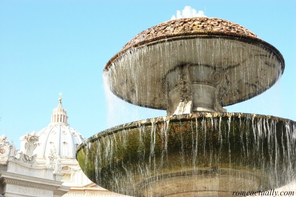 Image: St peter square fountain in the Vatican