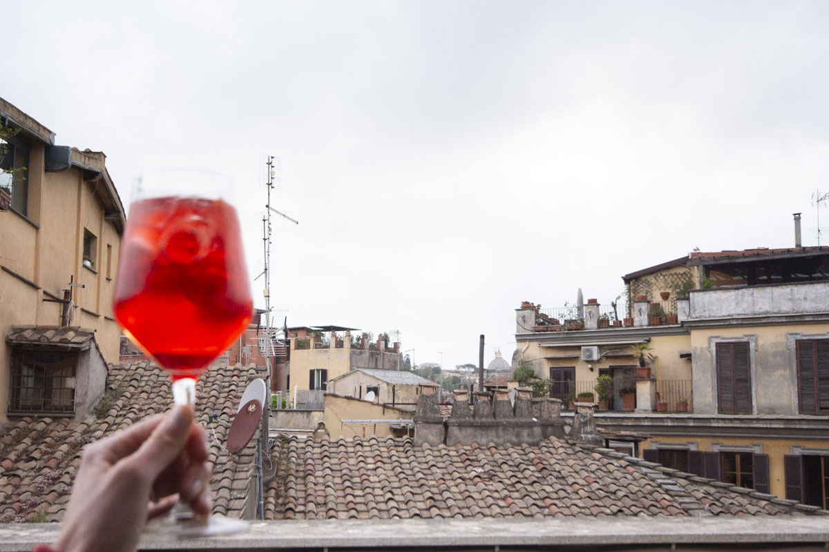 Image: Campari Aperitif on a rooftop during Taste Rome like a Local food tour in Rome with Devour Tours.